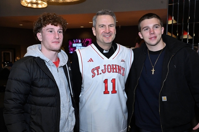 Archbishop Hicks and two males