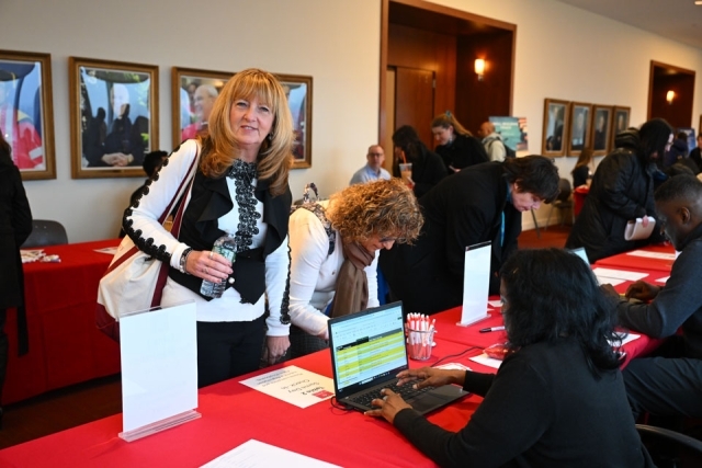 People walking around a professional development event 