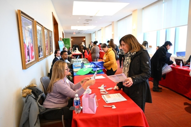 People walking around a professional development event 