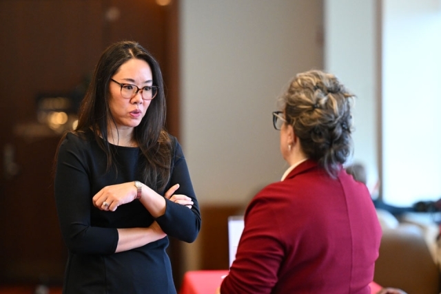 Women speaking to another woman 