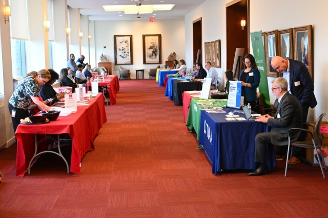 Room of informational tables at an event 