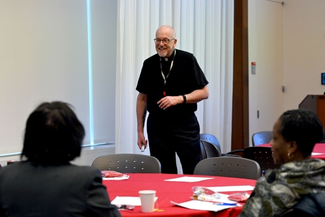 Man speaking at an event 