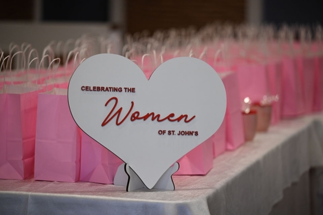 Sign with the words 'celebrating the women of St. John's' 
