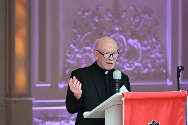 Man speaking at a podium 