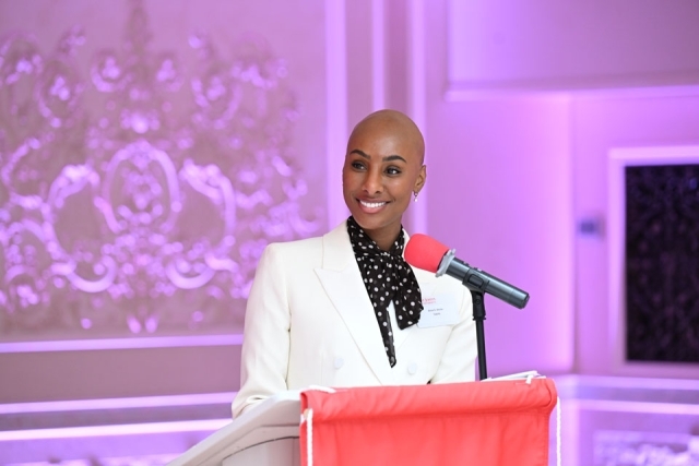 Woman smiling at the podium 