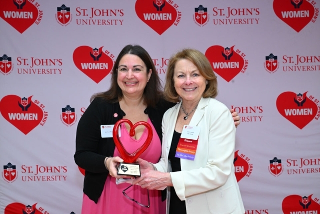 Two woman smiling for photo 