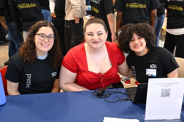 Three woman smiling for photo 