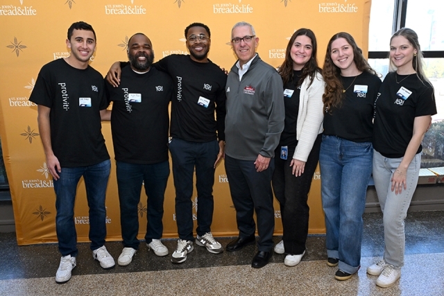 Individuals posing for a photo 