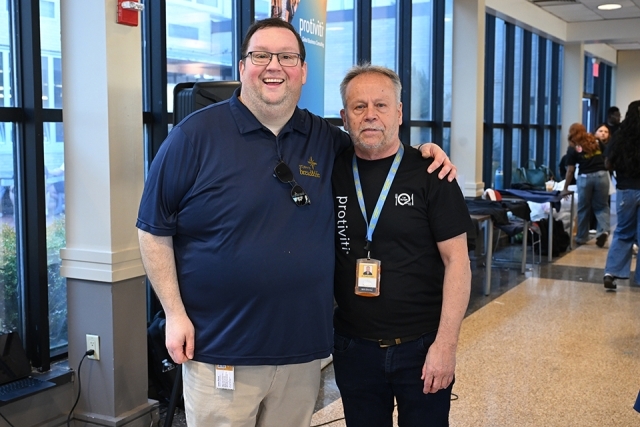 Two volunteers posing for photo 