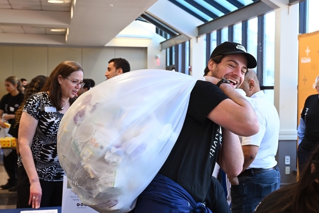 Student carrying bad filled with food 