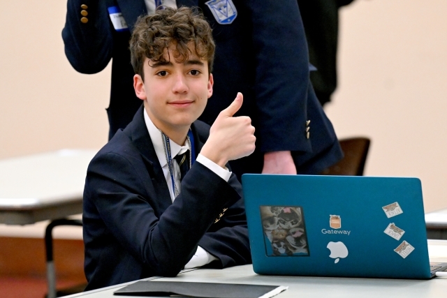 Young man giving a thumbs up 