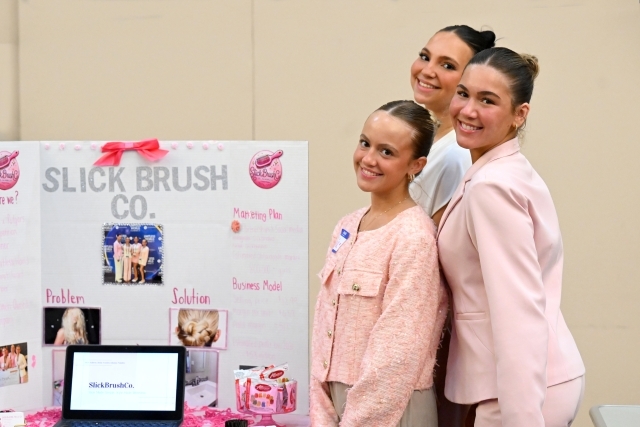 Three woman posing for a photo 