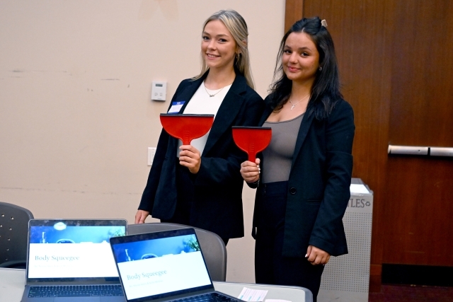 Two woman posing for a photo 