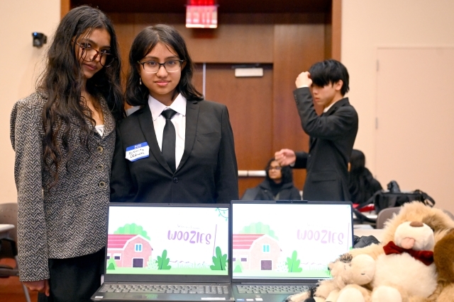 Two woman posing for a photo 