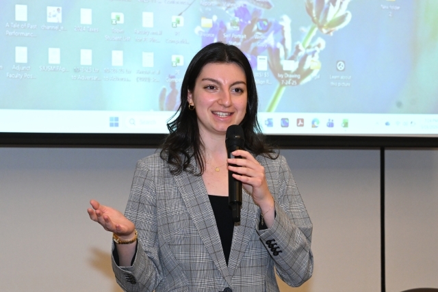 Young woman speaking in a microphone