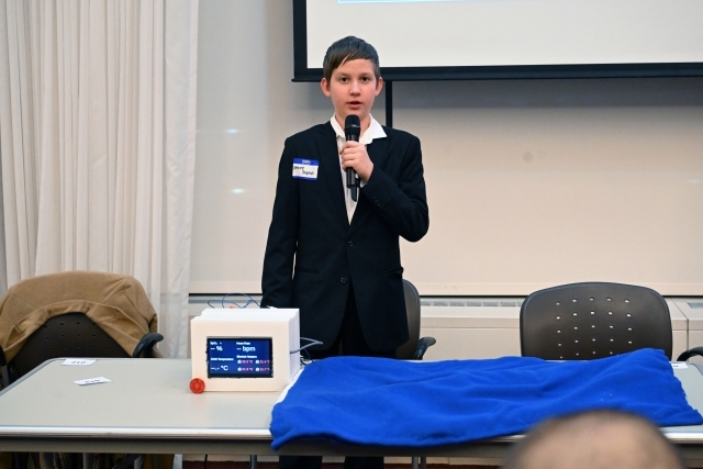 Individual speaking into a microphone 