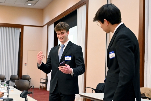 Young men speaking in a microphone
