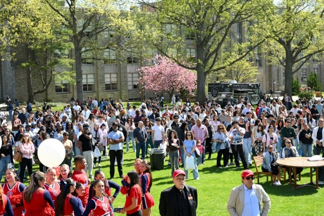 Glass area filled with future St. John's students and staff 