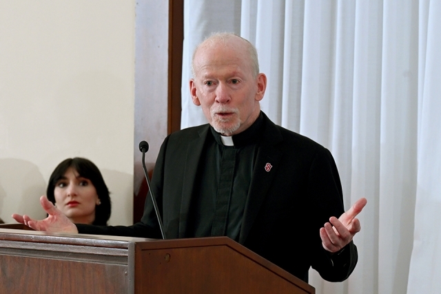 Father Shanley talking at President's Society event at St. John's 
