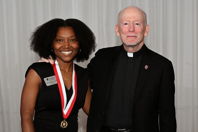Photo of Honoree and father shanley at President's Society event at St. John's 