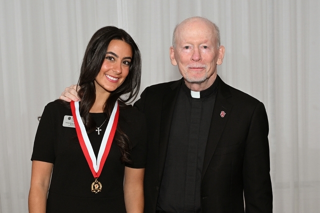 Photo of Honoree and father shanley at President's Society event at St. John's 