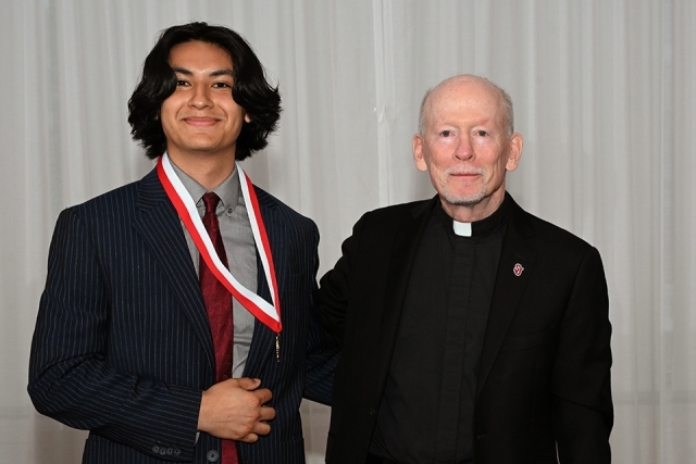 Photo of Honoree and father shanley at President's Society event at St. John's 