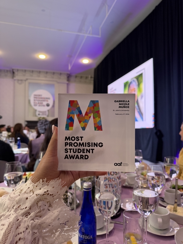 Gabriella Munoz with her American Advertising Federation award