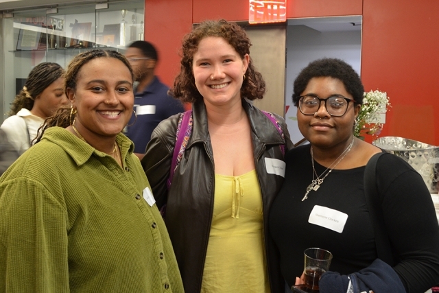 Three people smiling for photo 