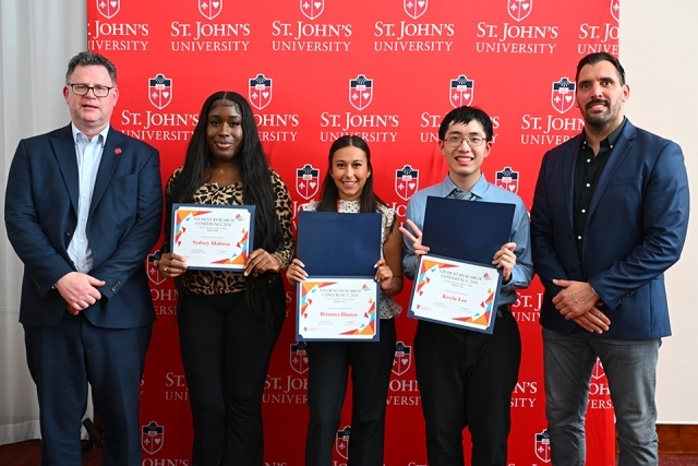 Group of St. John's students holding awards