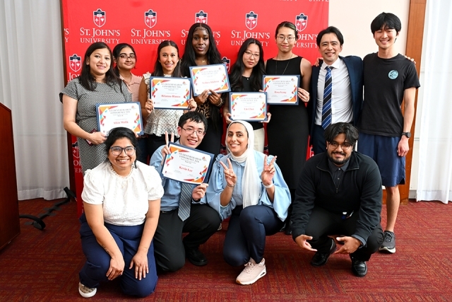 Group of St. John's students holding awards