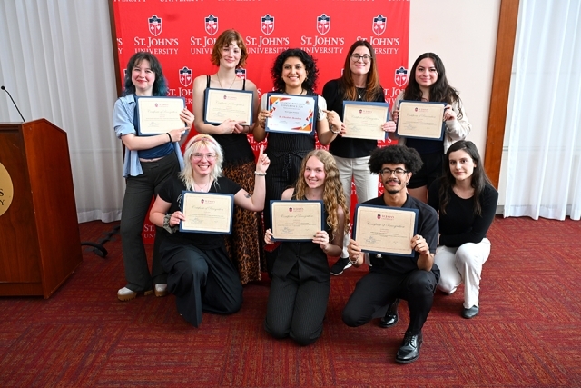 Group of St. John's students holding awards