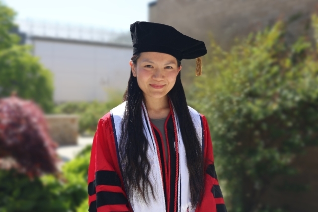 St. John's Law Pro Bono Scholar Sam Chen in her graduation cap and gown.