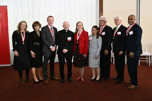 Photo of Eight Honorees with Fr. Shanley from 2026 Alumni Convocation