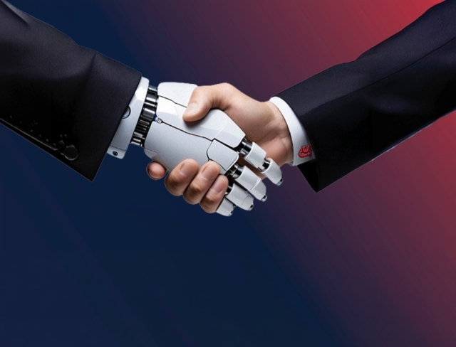 human and robot hand shaking 