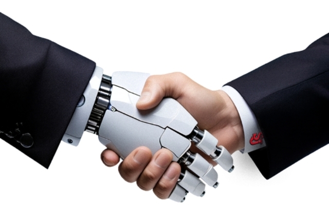 Robot hand shaking a human hand 