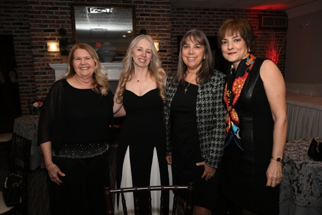 Distinguished faculty, alumni, and practitioner award recipients pose together at the College of Pharmacy and Health Sciences gala.