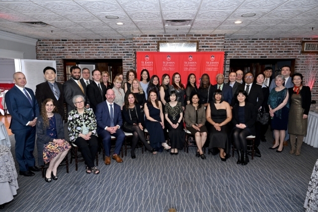 Faculty, staff, alumni, students, and guests gather for a community photo at the St. John's University College of Pharmacy and Health Sciences gala.