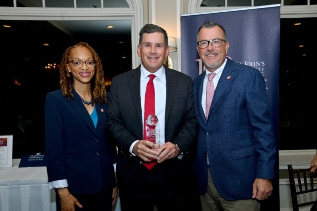 St. John's Law Dean Jelani Jefferson Exum, Eric Belfi, and Associate Dean Brian Woods.