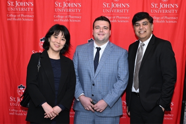 Faculty award recipients pose with their crystal awards at the College of Pharmacy and Health Sciences gala.