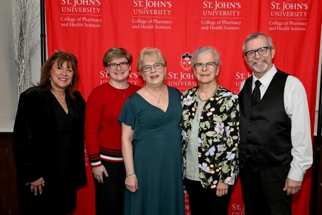 Family members and guests pose for a photo during the College of Pharmacy and Health Sciences awards gala.