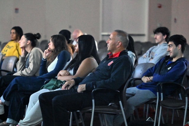 Student watching documentary screening