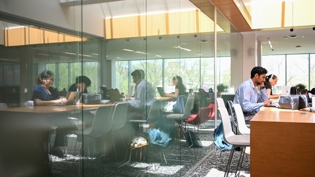 Students on computers at tables
