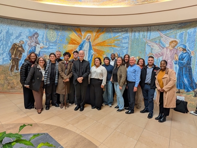 Fr. James Martin poses with St. John's attendants from his lecture