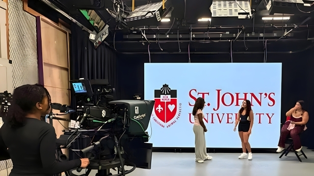St. John's students in front of a large screen 