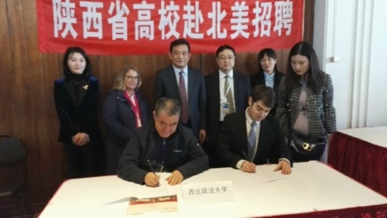 Carl Olson Sign NWUPL Teaching Contract