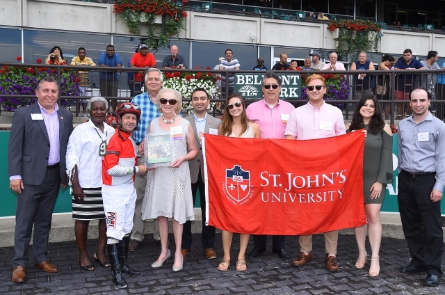 Group of people holding St. John's Flag