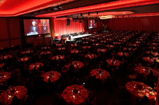 Dinner in Ballroom with speakers on screen at podium