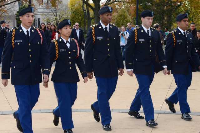 5 students dressed in ROTC uniform walking