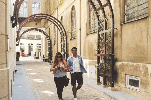 Two students walking on campus