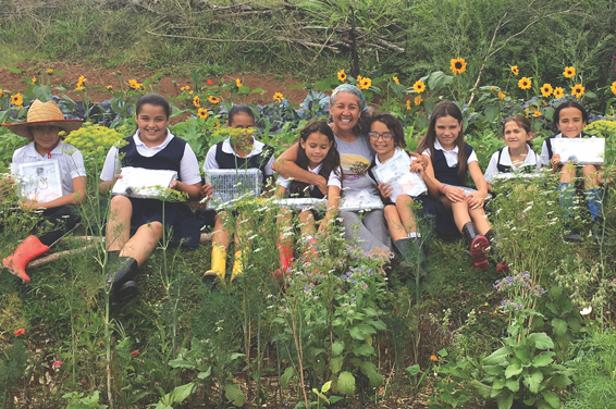 Children from Escuela Segunda Unidad Botijas #1 with the solar panels made for them by St. John’s students